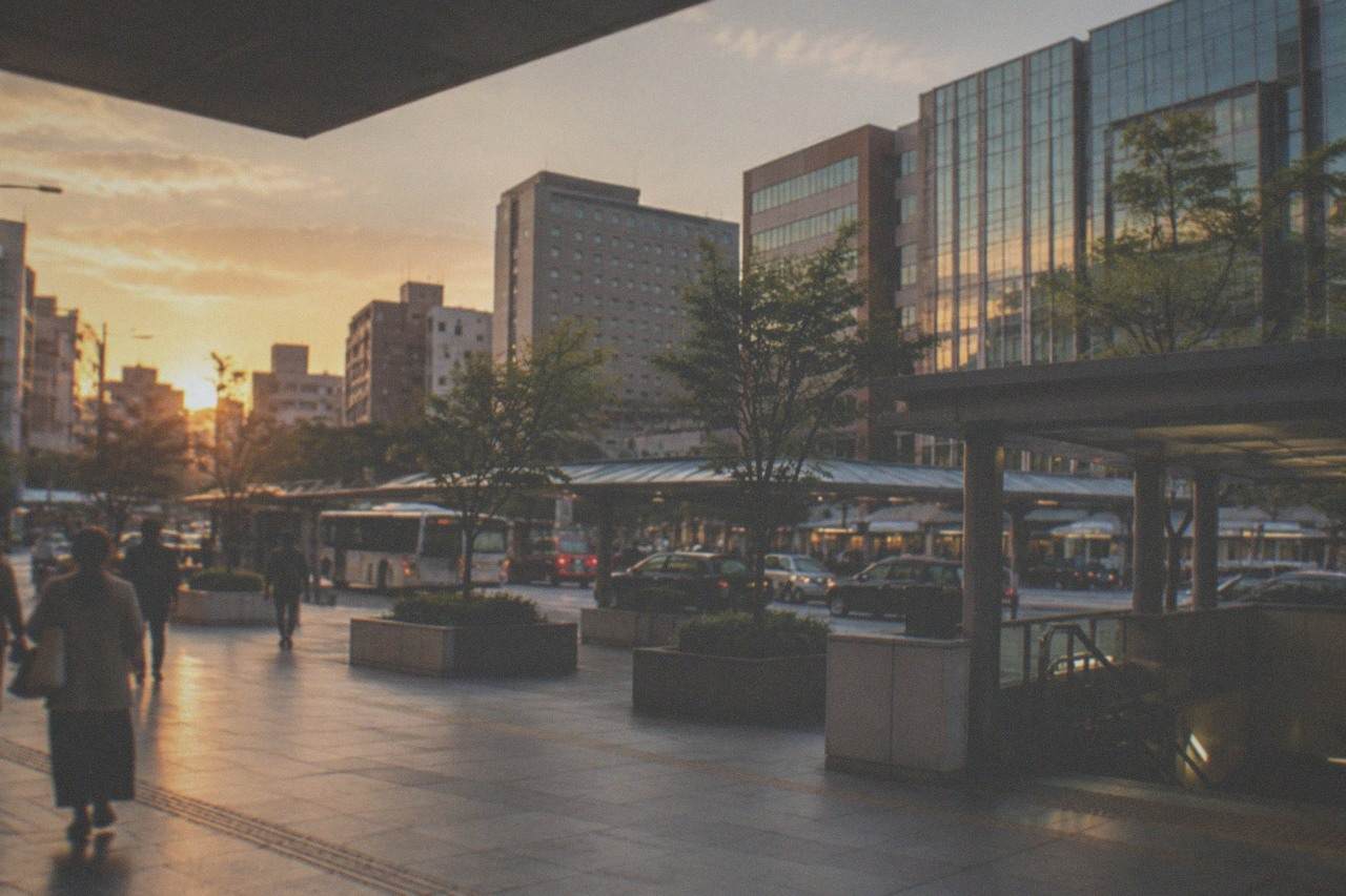 Hakata Station district skyline with hotel towers and the subway entrance at dusk