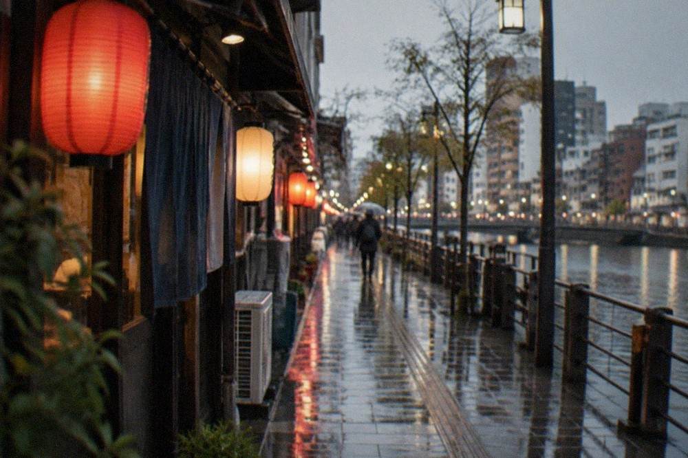 Rain-slicked Nakasu street at night with lanterns reflecting on wet pavement