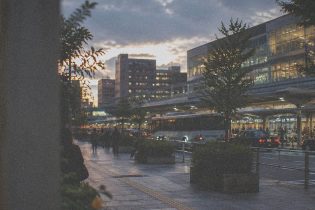 Evening view of illuminated buildings around Hakata Station in Fukuoka