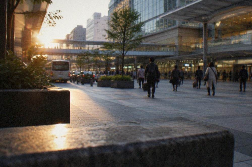 The concourse of Hakata Station with travellers moving between ticket gates and shops