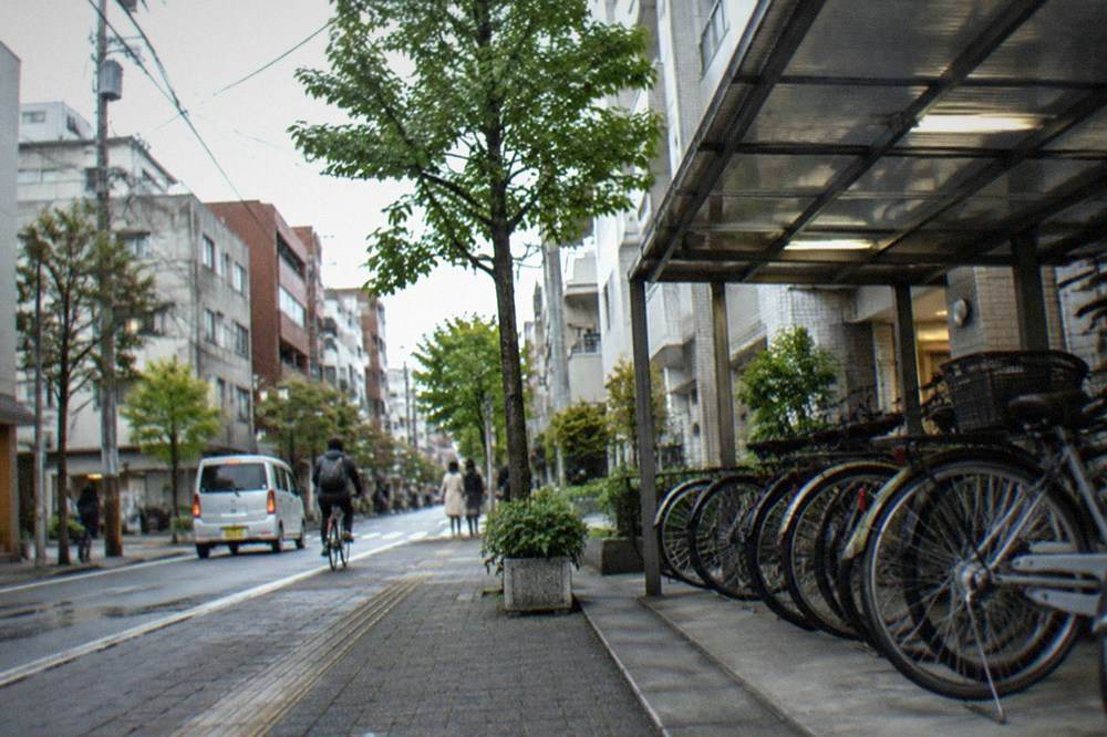 A row of rental bicycles parked in a covered area near Hakata Station