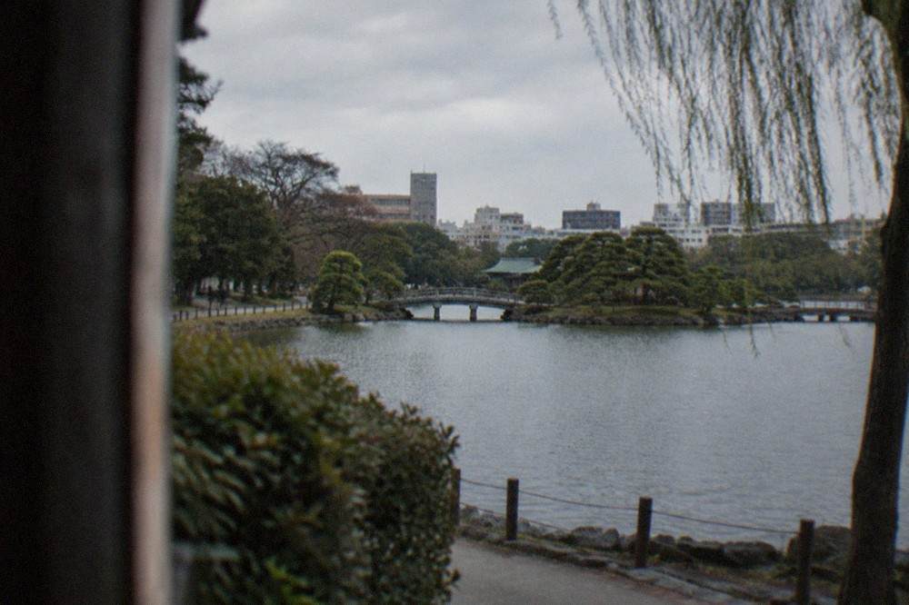 Ohori Park lake with the Japanese garden and city skyline beyond
