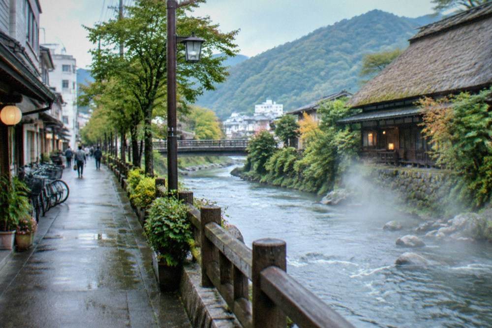 A thatched roof inn beside a mountain river with steam drifting over the water