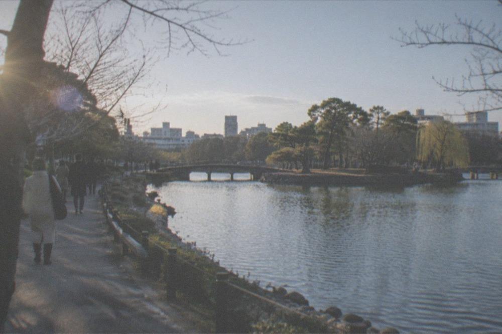 Cold clear winter morning over Ohori Park lake with bare trees