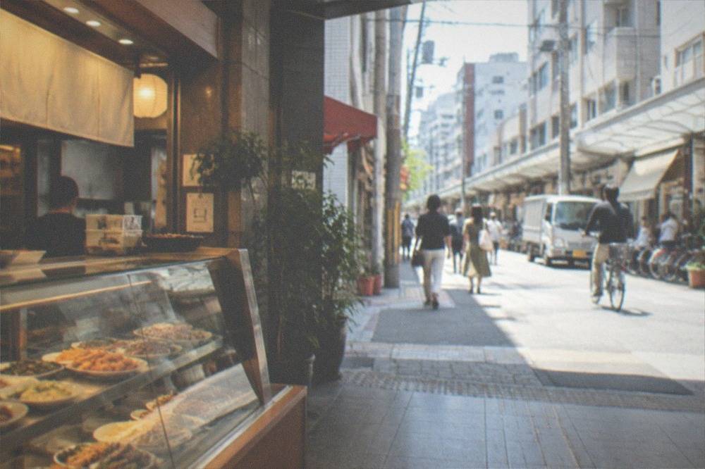 A basement food hall with glass counters of prepared dishes under warm lighting