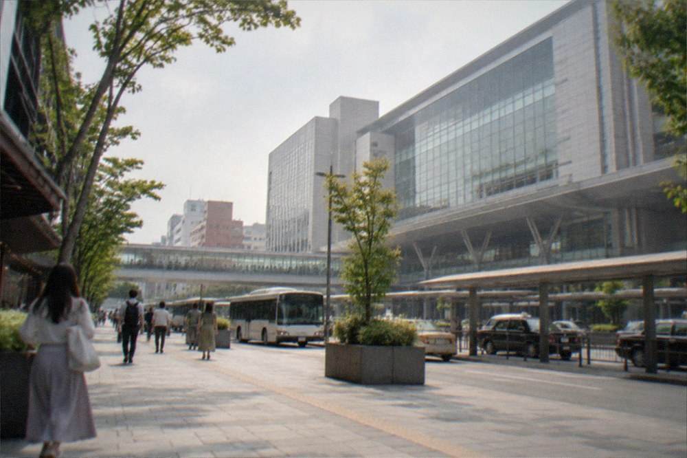 Modern subway station platform in Fukuoka with a train arriving and clean tiled walls